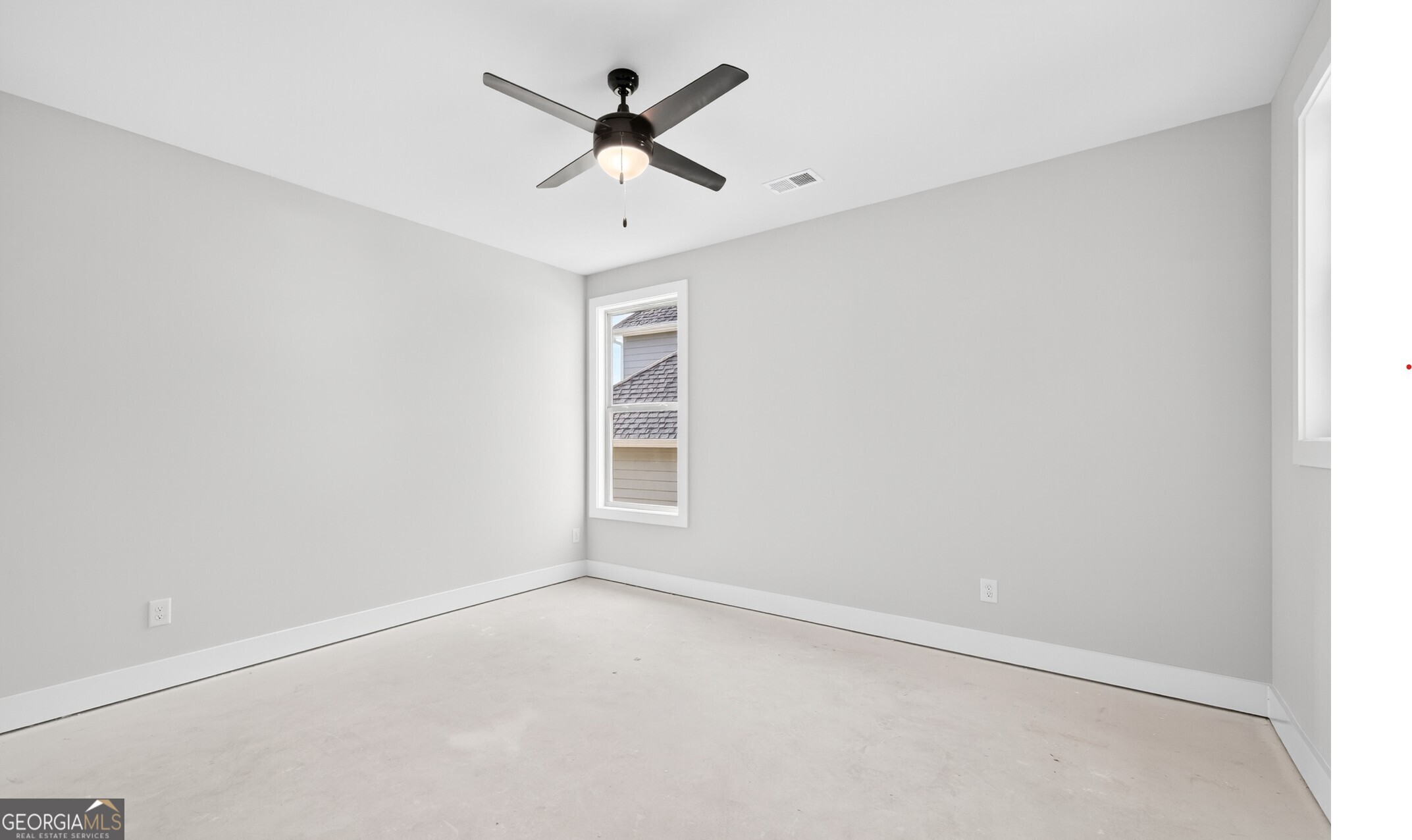 132 Patillo Manor, Unit 8 Stockbridge, GA 30281 - Photo 20 of 36 an empty room with a window and a fan