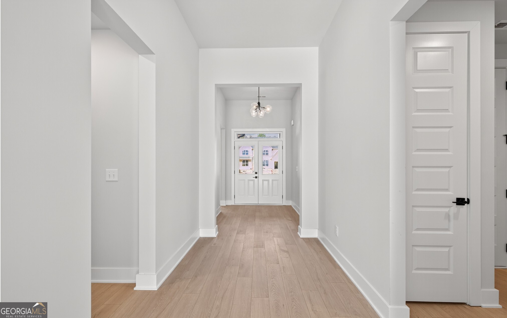 132 Patillo Manor, Unit 8 Stockbridge, GA 30281 - Photo 22 of 36 a view of a hallway with wooden floor