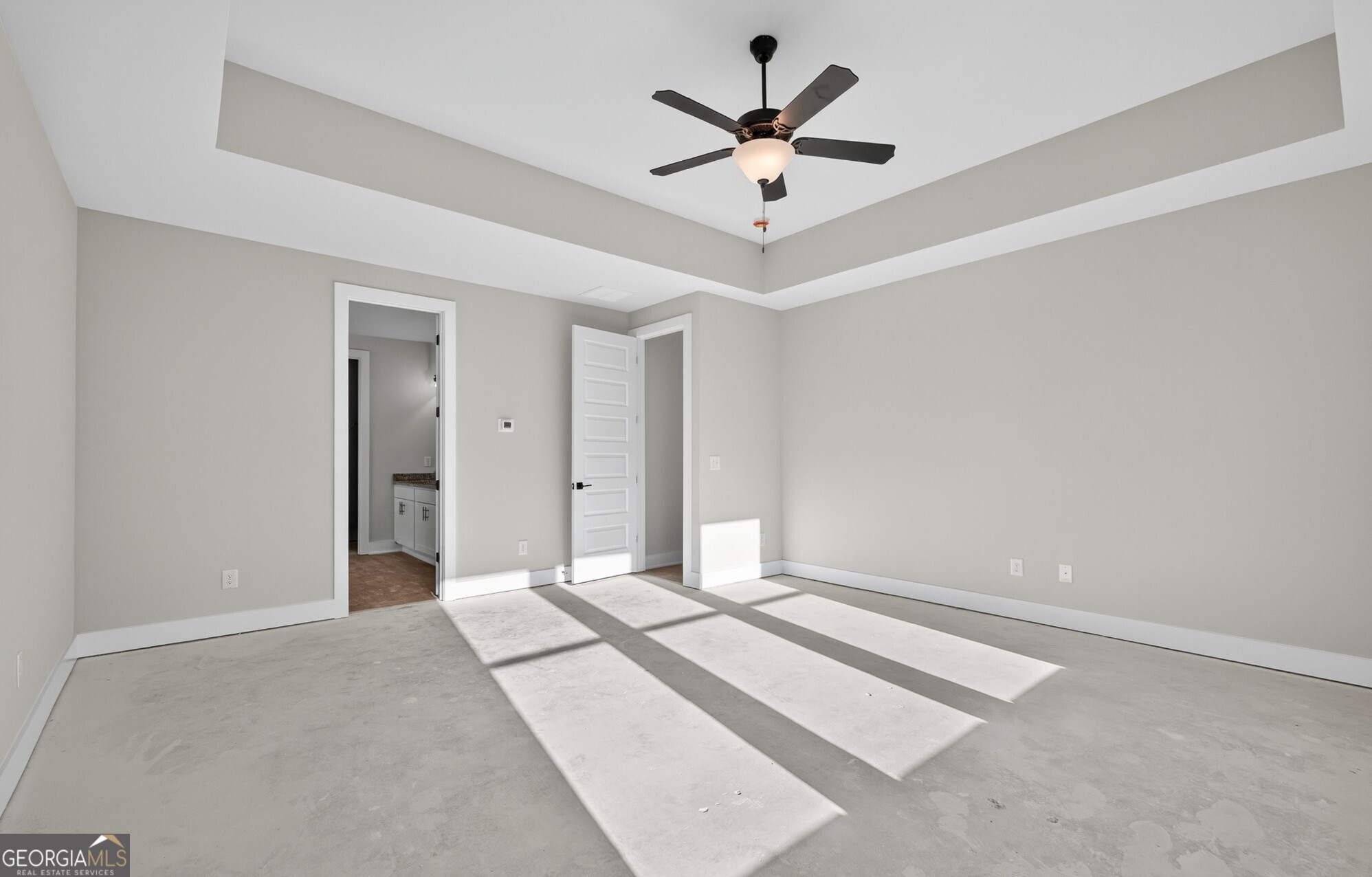 132 Patillo Manor, Unit 8 Stockbridge, GA 30281 - Photo 27 of 36 an empty room with fan and windows