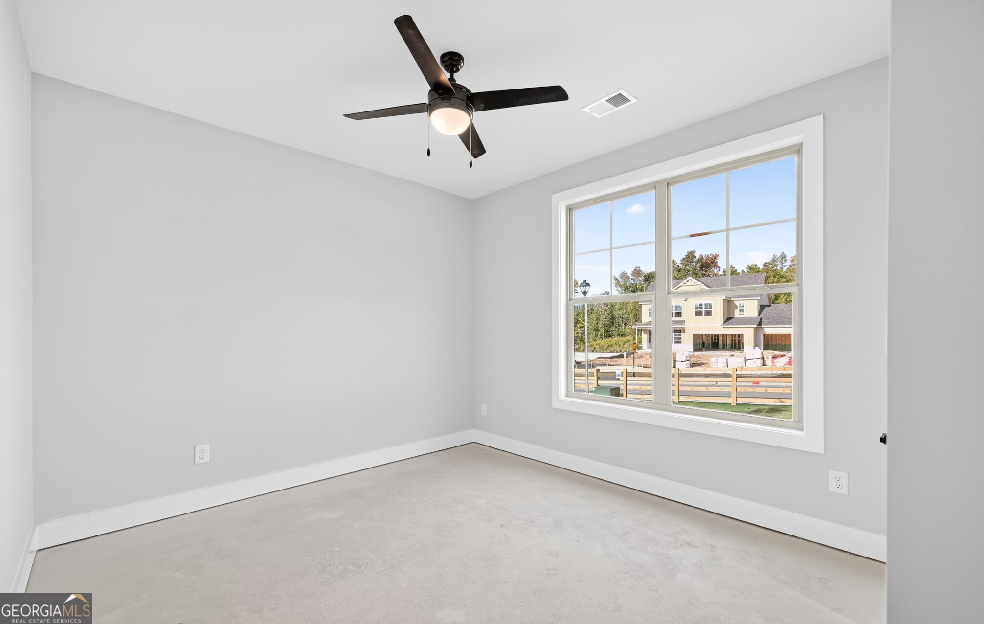 132 Patillo Manor, Unit 8 Stockbridge, GA 30281 - Photo 34 of 36 a view of an empty room with a window