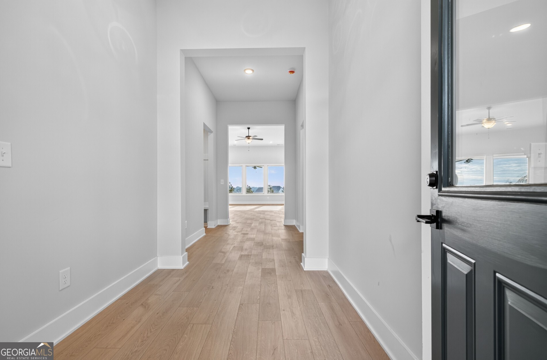 132 Patillo Manor, Unit 8 Stockbridge, GA 30281 - Photo 7 of 36 a view of a hallway with wooden floor