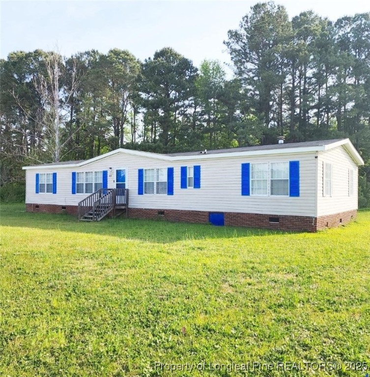 420 Pine Tree Road Lumberton, NC 28360 - Photo 2 of 18 a view of a house with pool and a yard