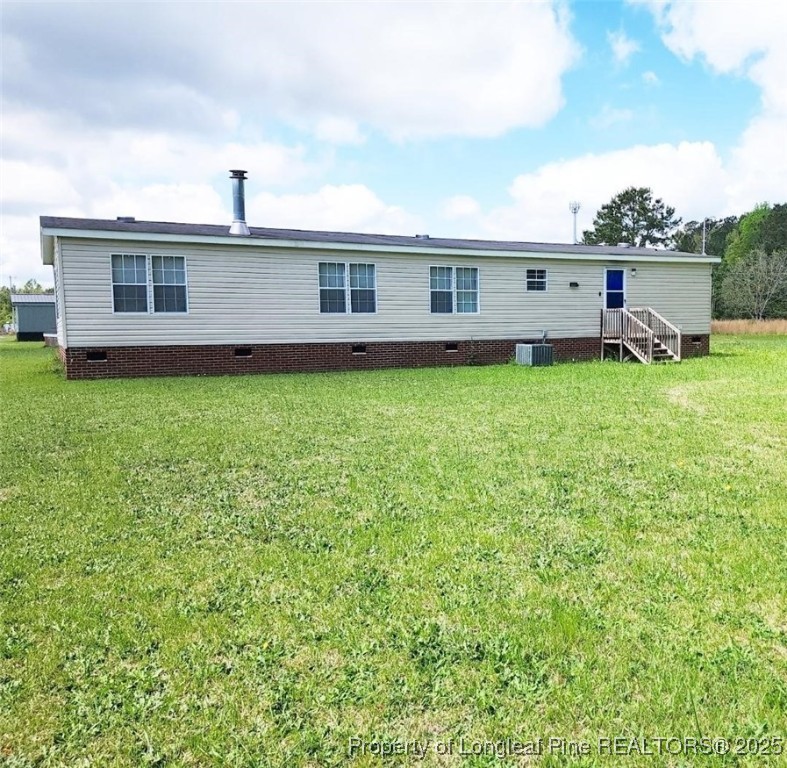 420 Pine Tree Road Lumberton, NC 28360 - Photo 3 of 18 a front view of a house with garden