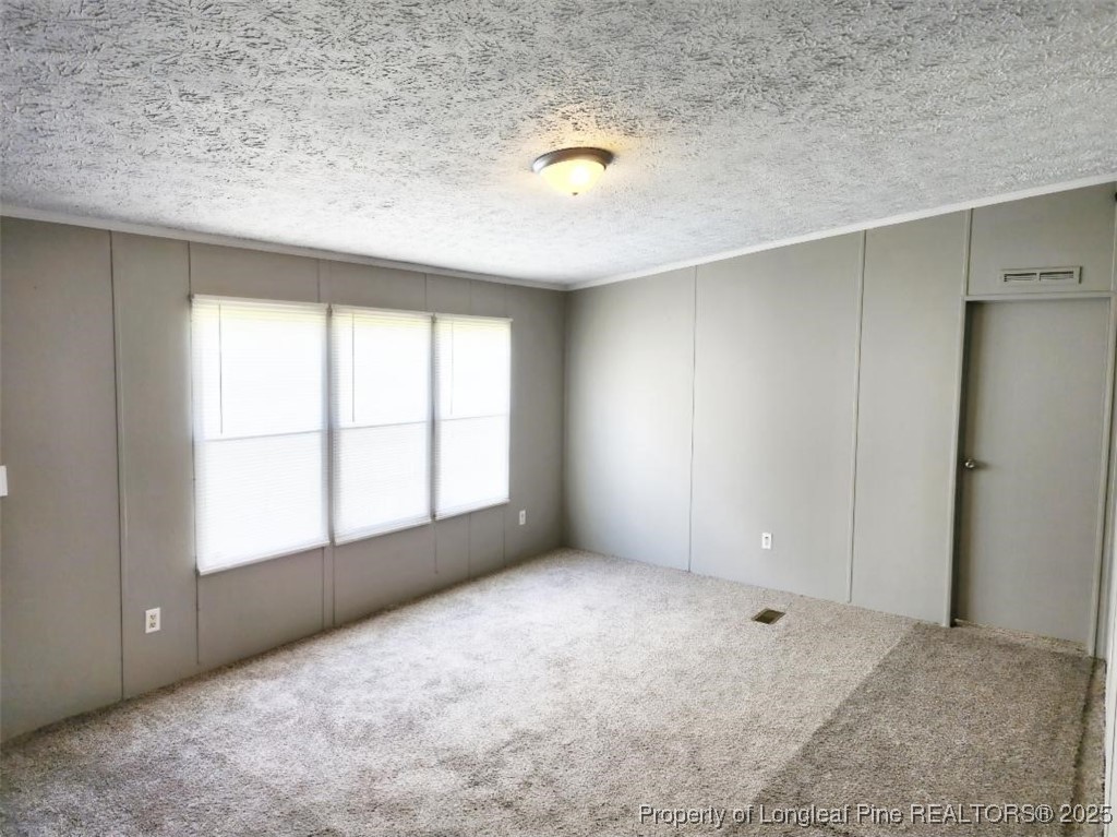 420 Pine Tree Road Lumberton, NC 28360 - Photo 5 of 18 an empty room with windows