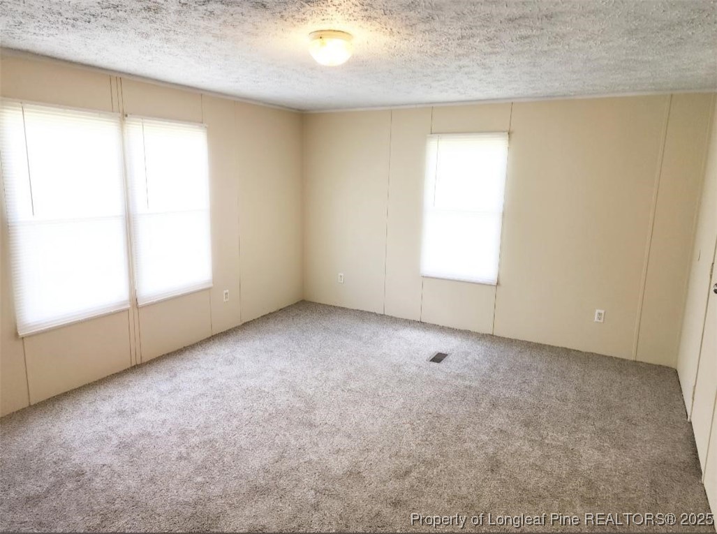 420 Pine Tree Road Lumberton, NC 28360 - Photo 6 of 18 an empty room with windows