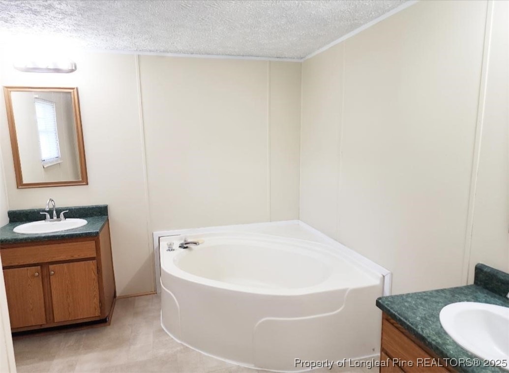 420 Pine Tree Road Lumberton, NC 28360 - Photo 7 of 18 a bathroom with a granite countertop sink and a mirror
