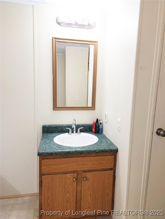 420 Pine Tree Road Lumberton, NC 28360 - Photo 8 of 18 a bathroom with a sink and a mirror