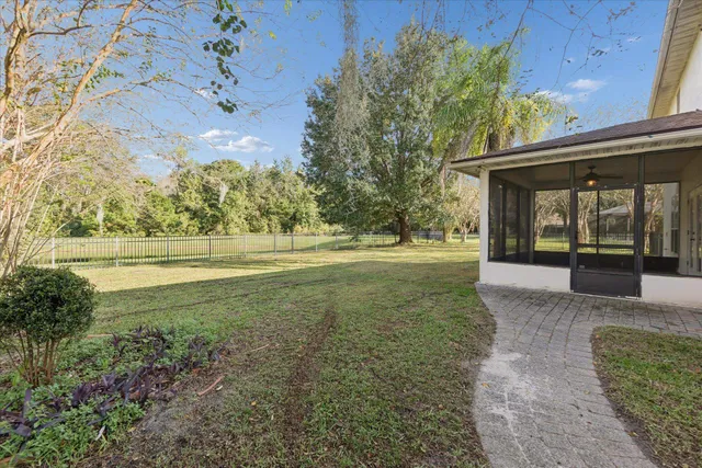 a view of outdoor space with garden and trees