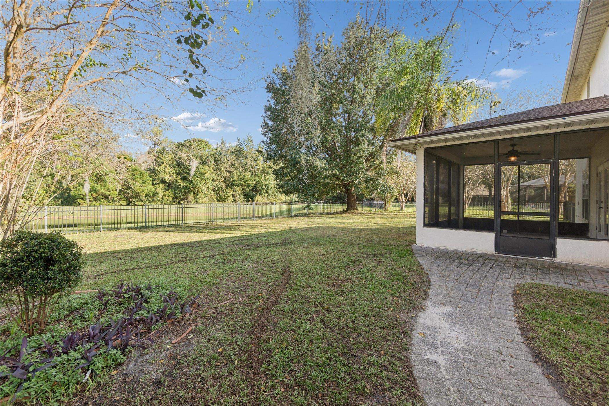 140 Corral Circle St. Augustine, FL 32092 - Photo 12 of 46 a view of outdoor space with garden and trees