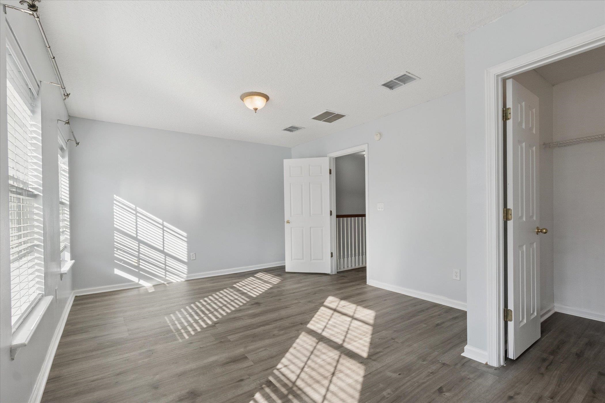140 Corral Circle St. Augustine, FL 32092 - Photo 20 of 46 a view of an empty room with wooden floor and a window