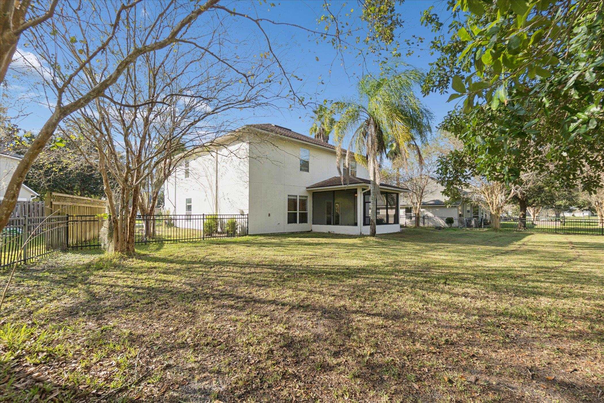 140 Corral Circle St. Augustine, FL 32092 - Photo 2 of 46 a front view of a house with a garden