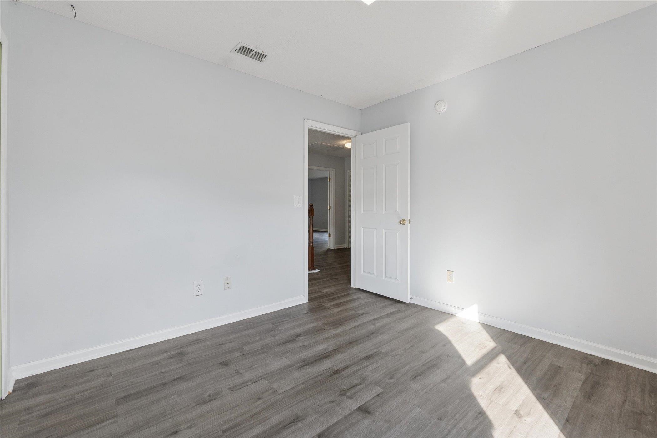 140 Corral Circle St. Augustine, FL 32092 - Photo 24 of 46 a view of an empty room with wooden floor