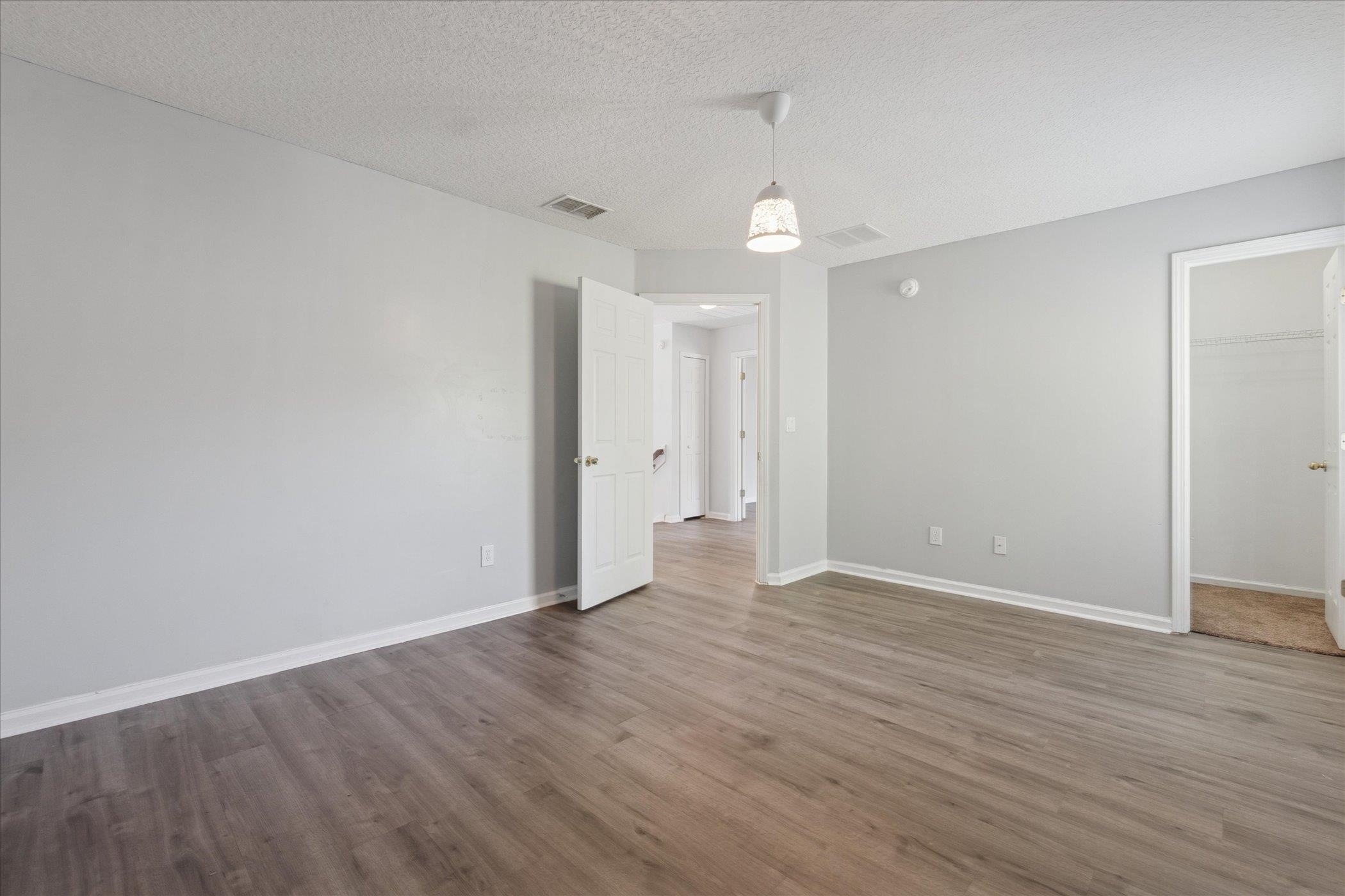140 Corral Circle St. Augustine, FL 32092 - Photo 27 of 46 a view of an empty room with wooden floor