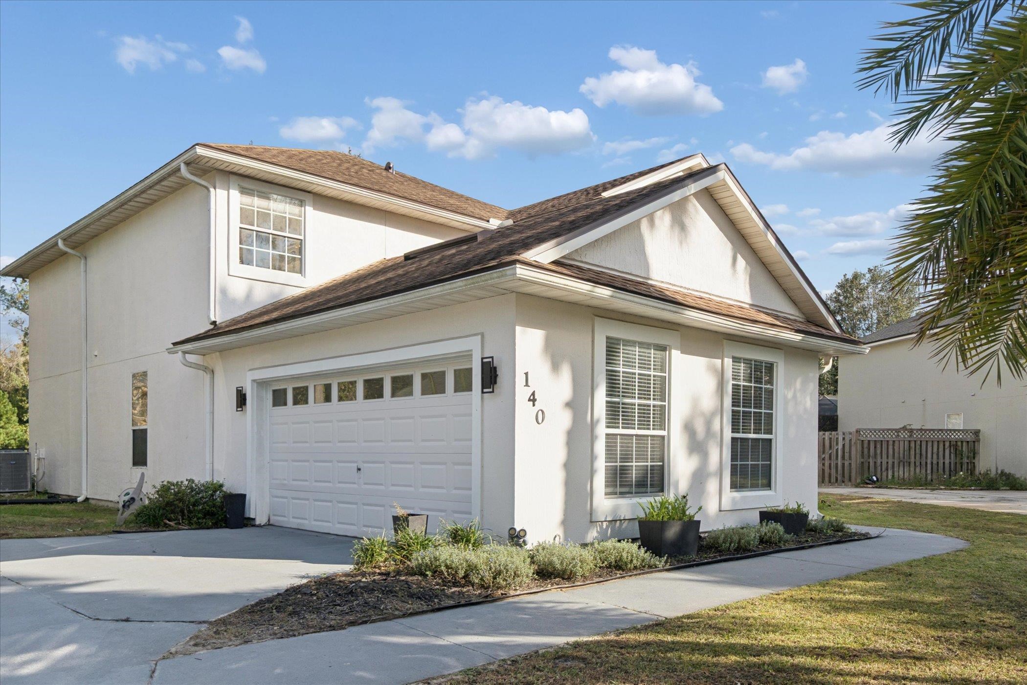 140 Corral Circle St. Augustine, FL 32092 - Photo 29 of 46 a front view of a house with garden