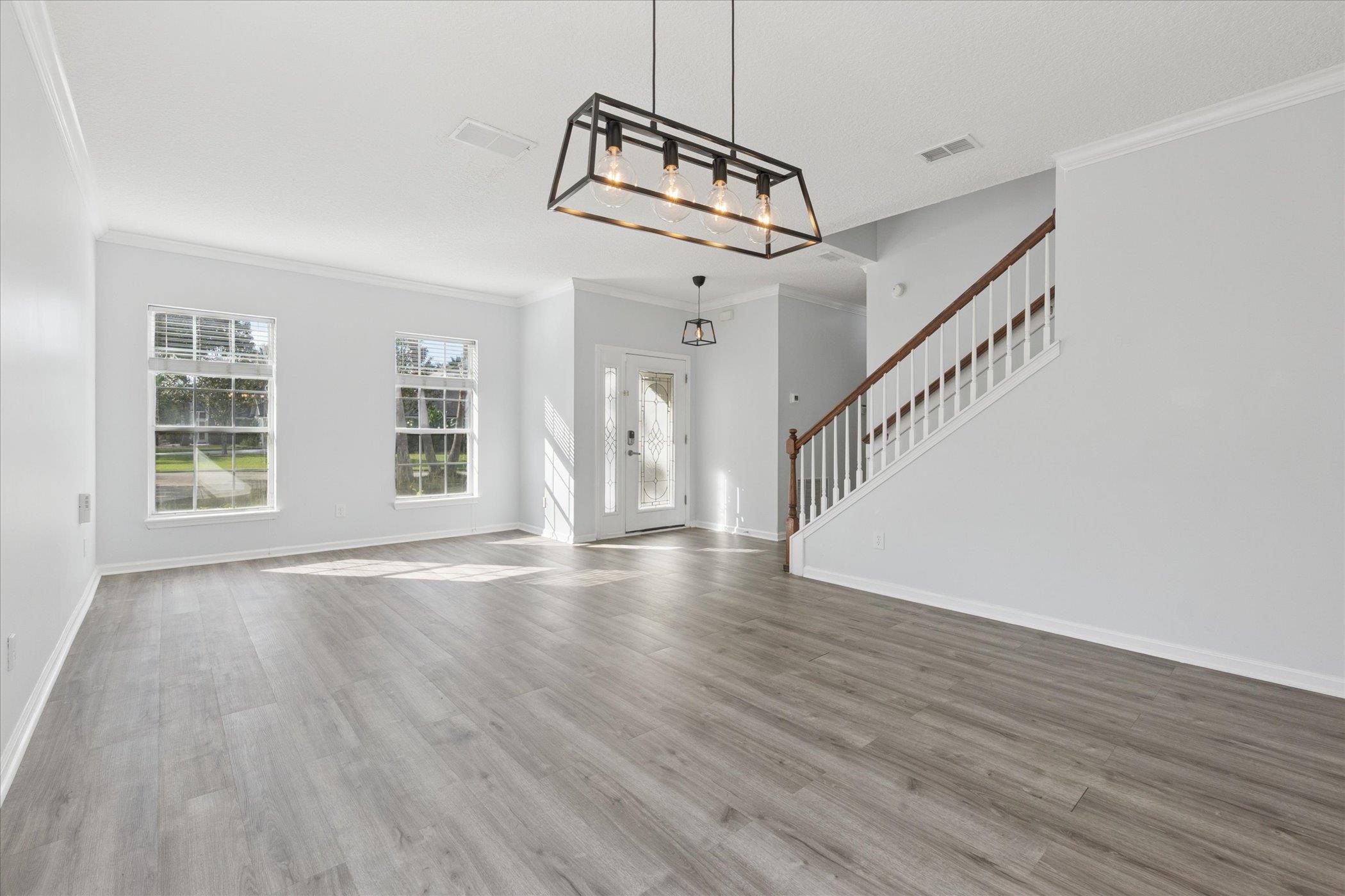 140 Corral Circle St. Augustine, FL 32092 - Photo 38 of 46 a view of an empty room with wooden floor and a window