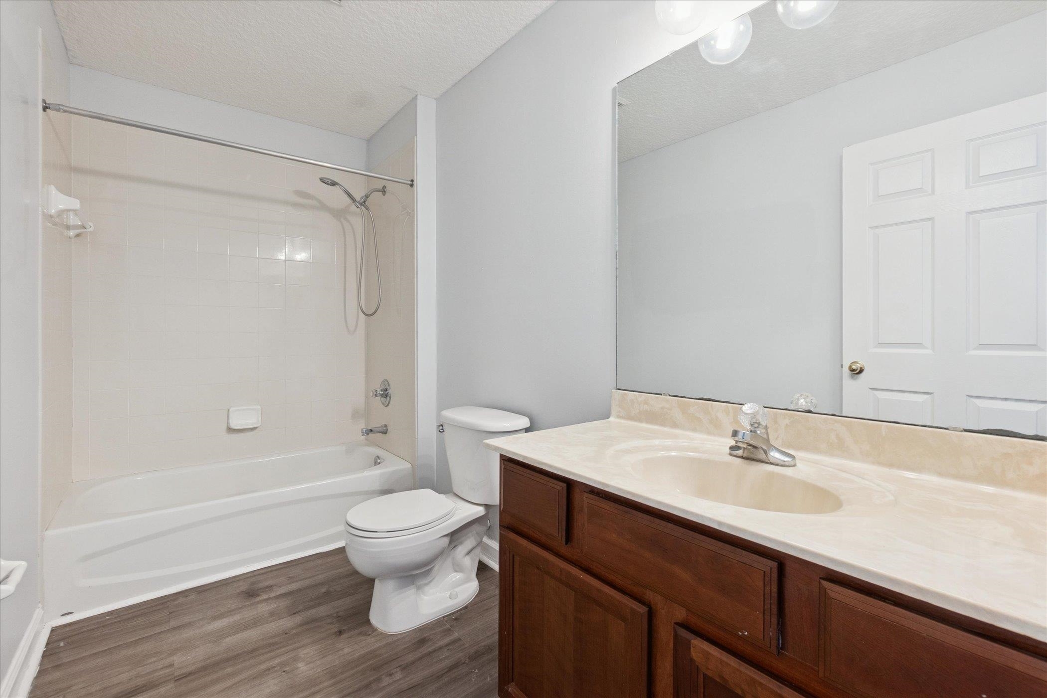140 Corral Circle St. Augustine, FL 32092 - Photo 41 of 46 a bathroom with a sink a toilet and a large mirror
