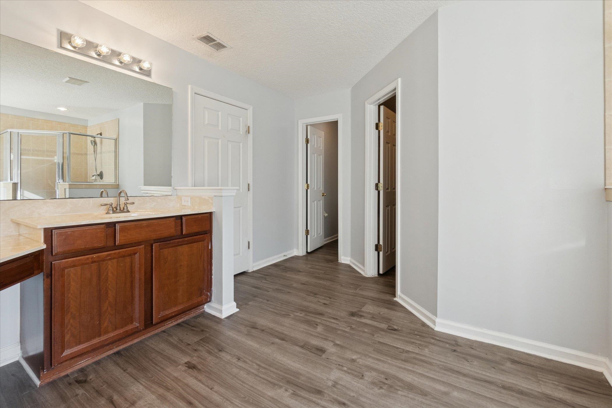 140 Corral Circle St. Augustine, FL 32092 - Photo 42 of 46 a bathroom with a sink and a mirror