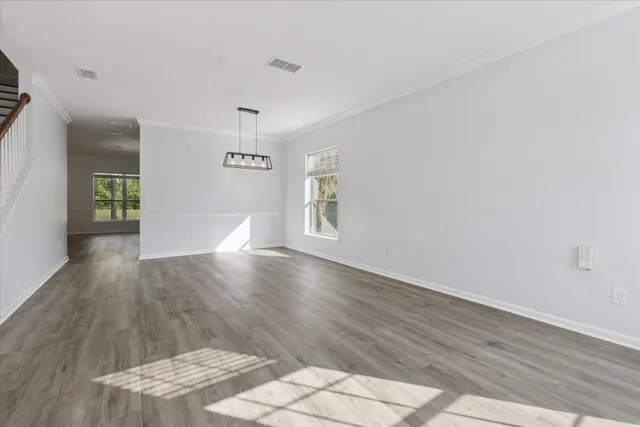 a view of livingroom with hardwood floor and hallway