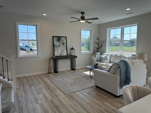 a living room with furniture and windows