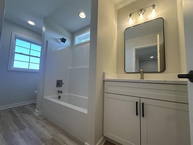 3150 South Bartells Drive Beloit, WI 53511 - Photo 30 of 43 a bathroom with a sink mirror and a bathtub