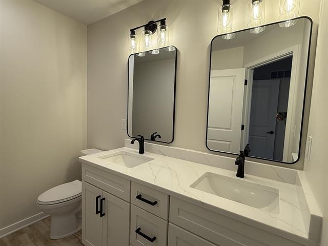 3150 South Bartells Drive Beloit, WI 53511 - Photo 36 of 43 a bathroom with a sink a toilet and a mirror