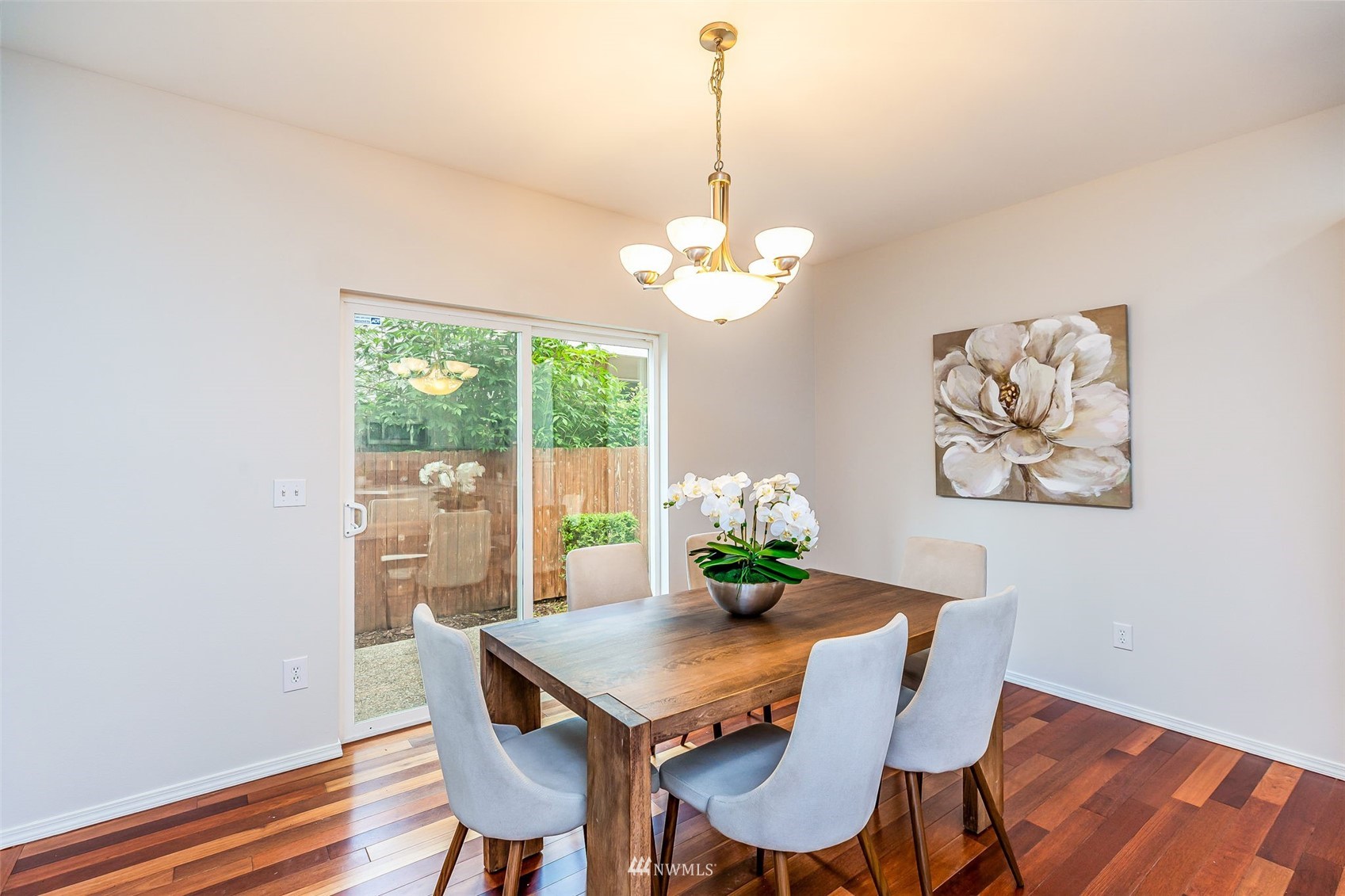 3331 182nd Place Southeast Bothell, WA 98012 - Photo 12 of 29 a view of a dining room with furniture a chandelier and wooden floor