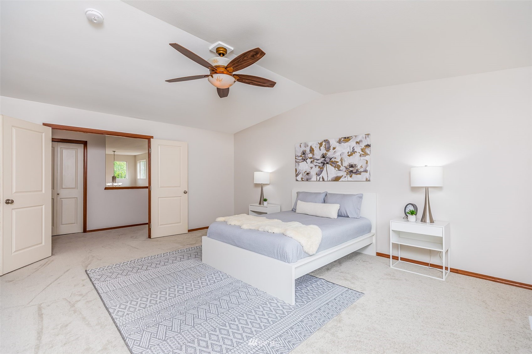 3331 182nd Place Southeast Bothell, WA 98012 - Photo 20 of 29 a bedroom with a large bed and a chandelier