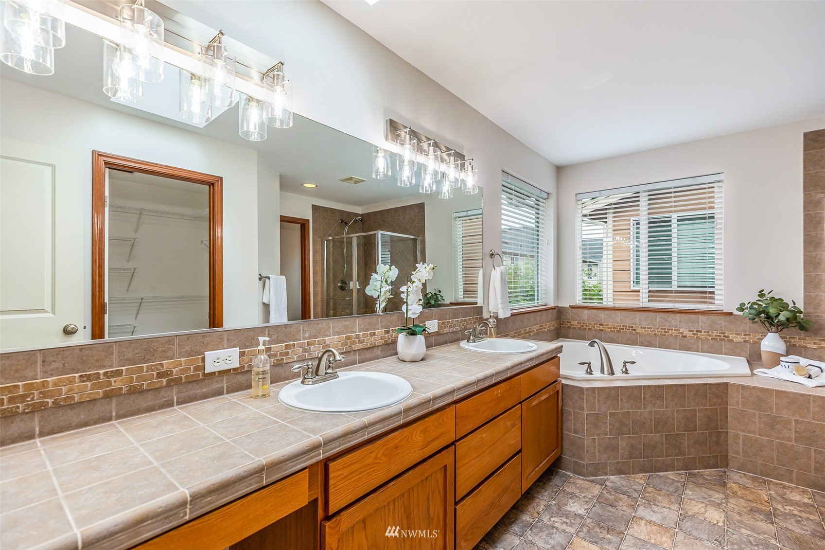3331 182nd Place Southeast Bothell, WA 98012 - Photo 21 of 29 a bathroom with a granite countertop sink and a bathtub