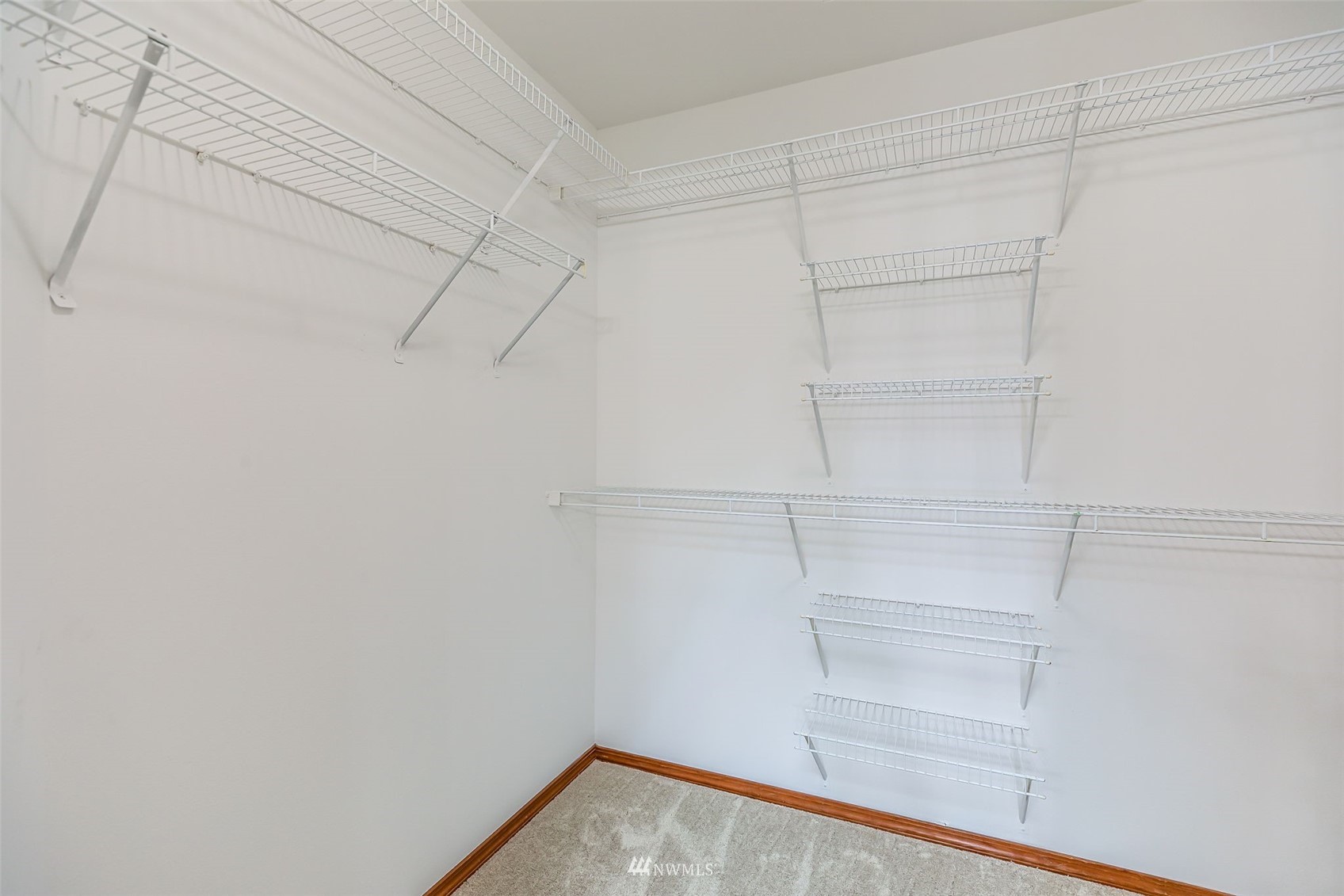 3331 182nd Place Southeast Bothell, WA 98012 - Photo 23 of 29 a view of walk in closet with empty racks