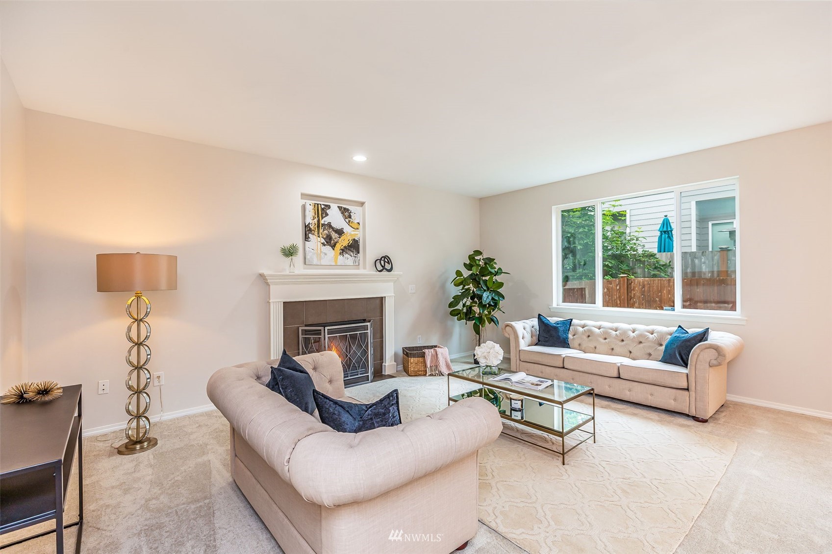 3331 182nd Place Southeast Bothell, WA 98012 - Photo 4 of 29 a living room with furniture and a fireplace