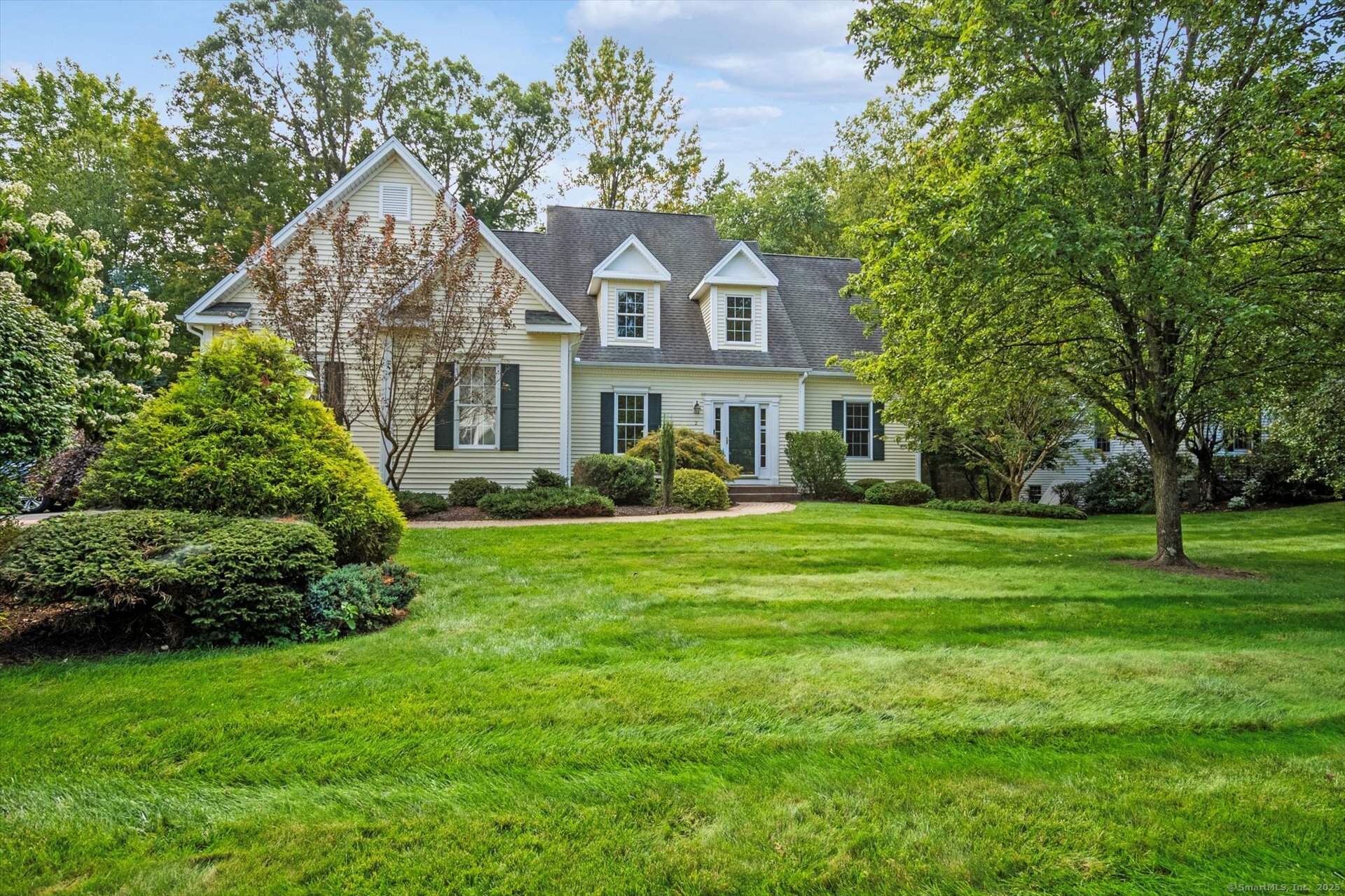 2 Muirfield Lane, Unit 2 Avon, CT 06001 - Photo 1 of 1 a front view of a house with a yard