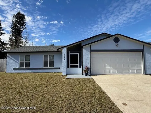 a front view of a house with yard