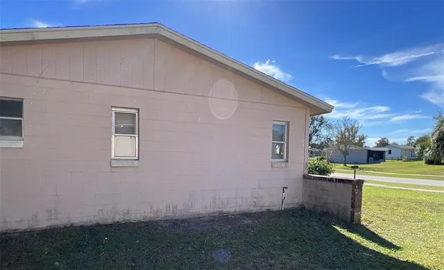 a backyard view with hardwood wall