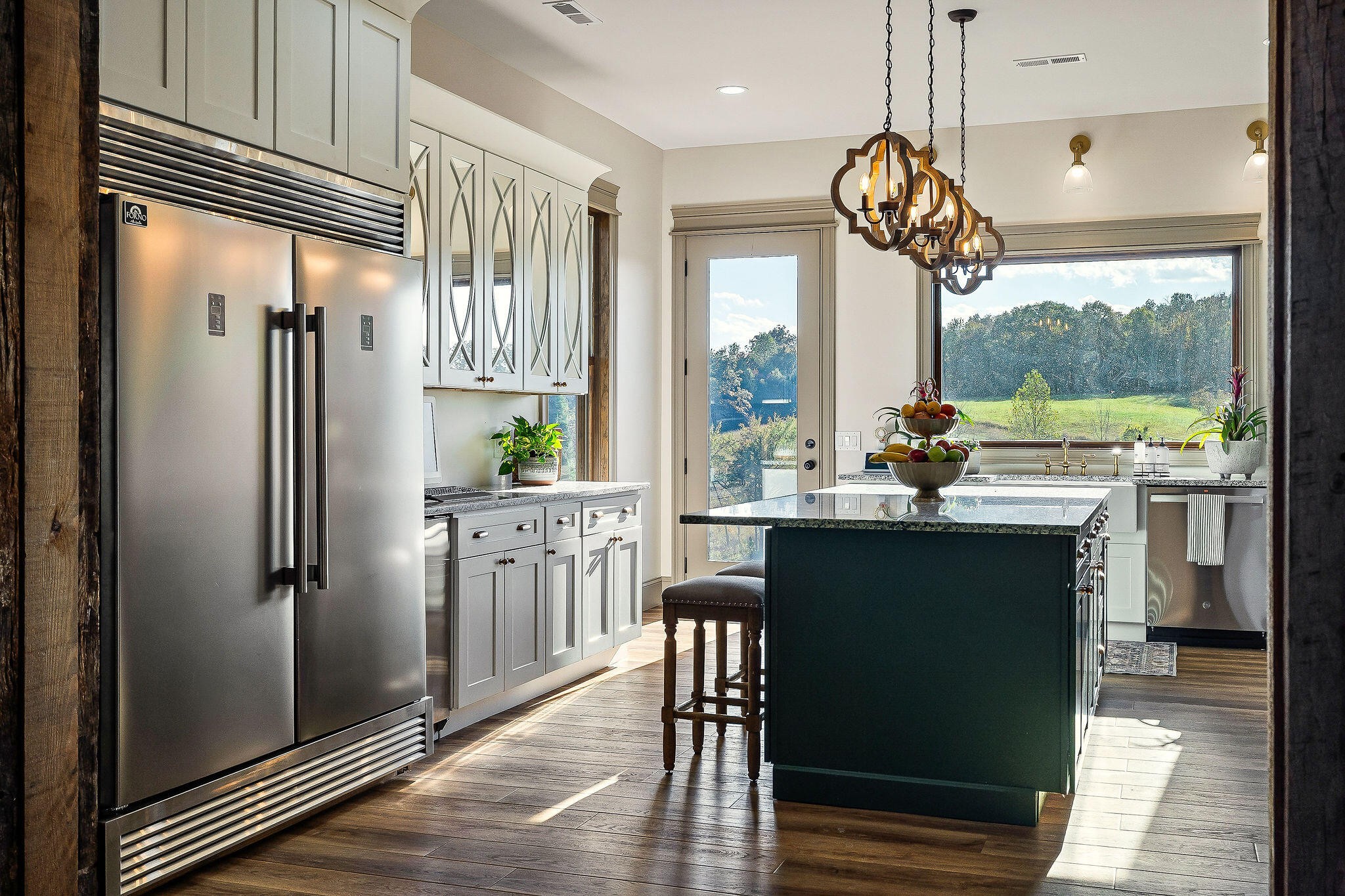 1656 Dibrell-Lucky Road McMinnville, TN 37110 - Photo 17 of 62 a kitchen with stainless steel appliances granite countertop a refrigerator a sink dishwasher a stove and a dining table with wooden floor