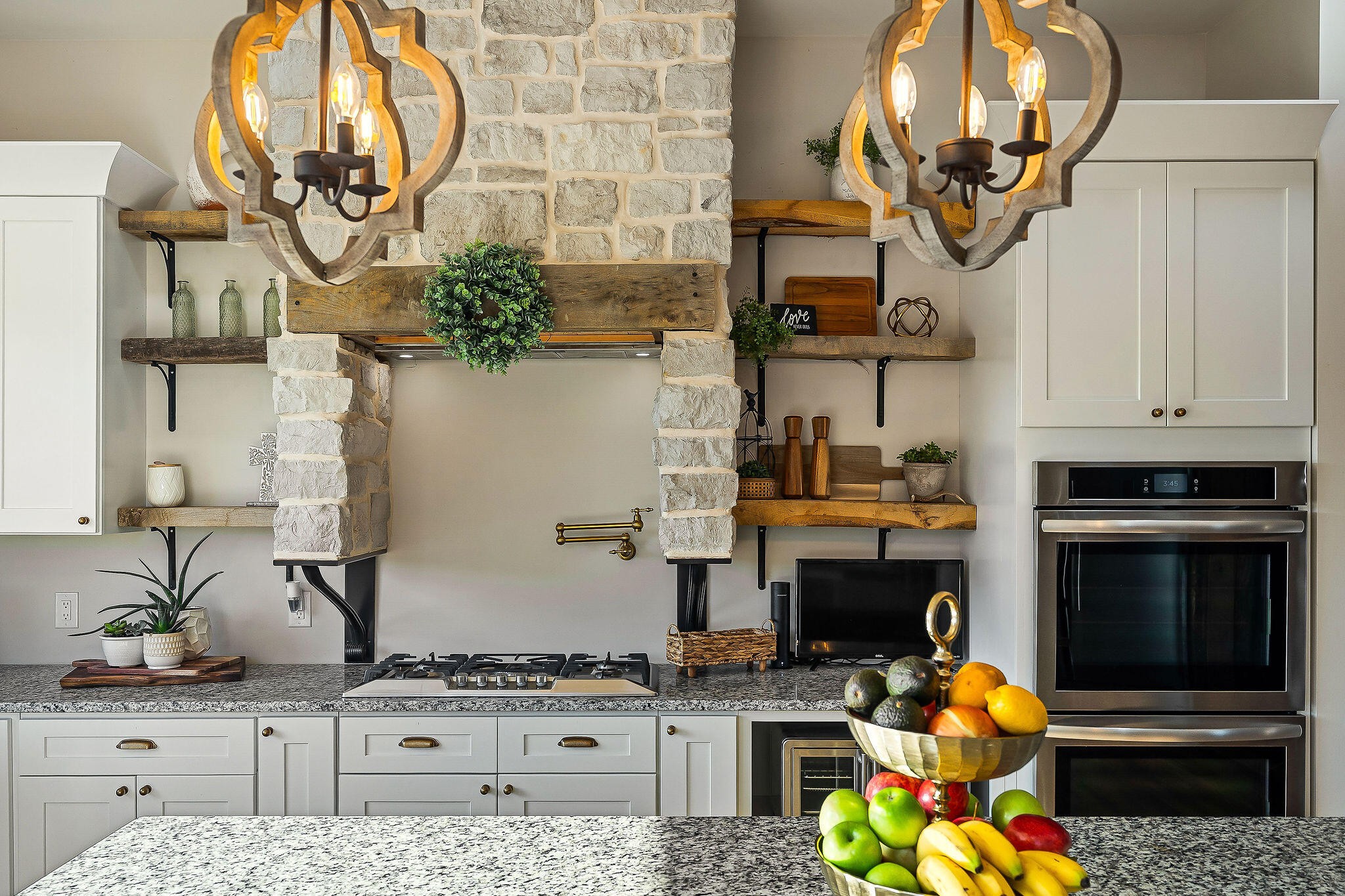 1656 Dibrell-Lucky Road McMinnville, TN 37110 - Photo 22 of 62 a kitchen with stainless steel appliances kitchen island granite countertop a stove a sink and a microwave