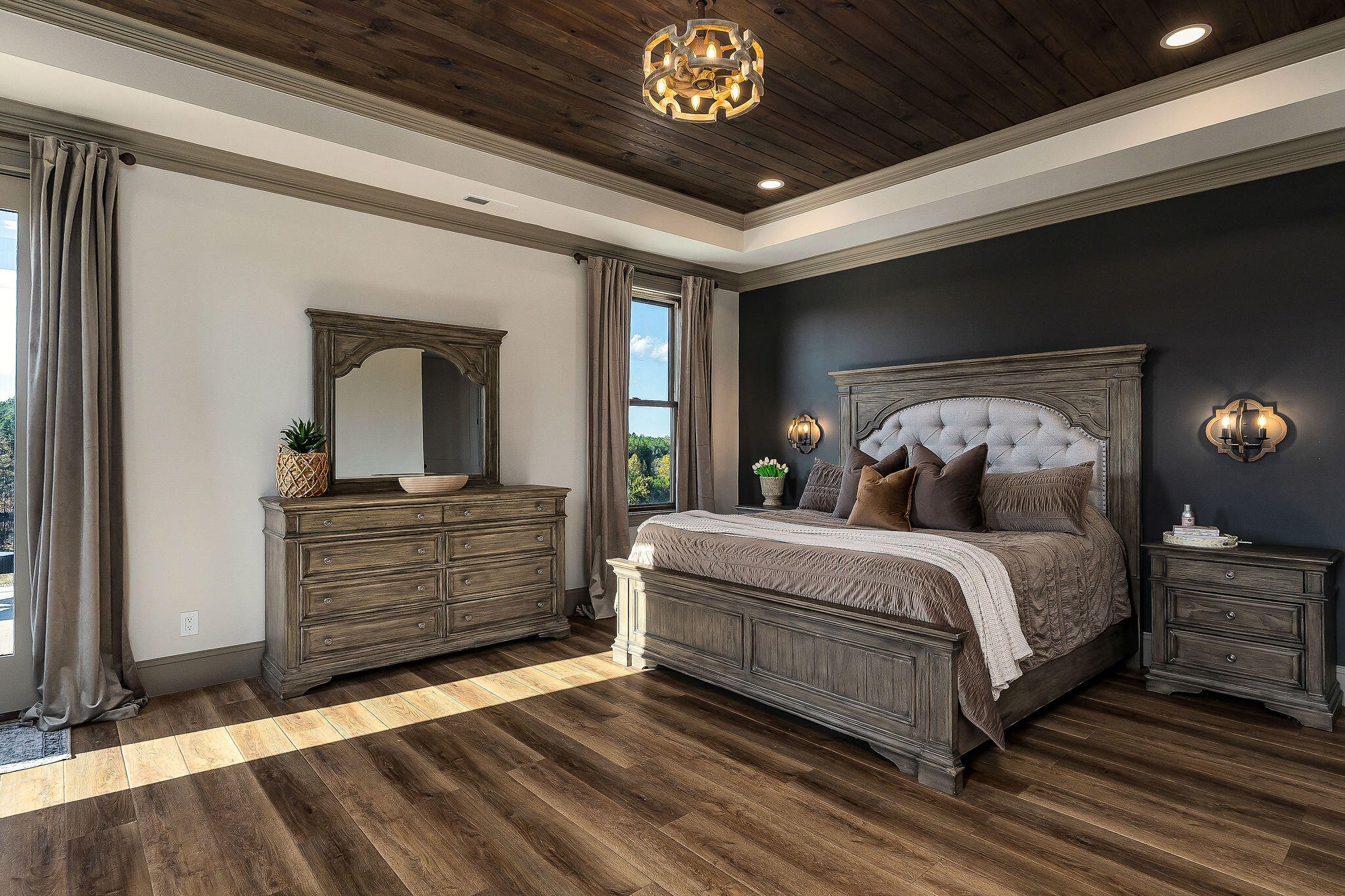 1656 Dibrell-Lucky Road McMinnville, TN 37110 - Photo 26 of 62 a bedroom with a large bed and a chandelier