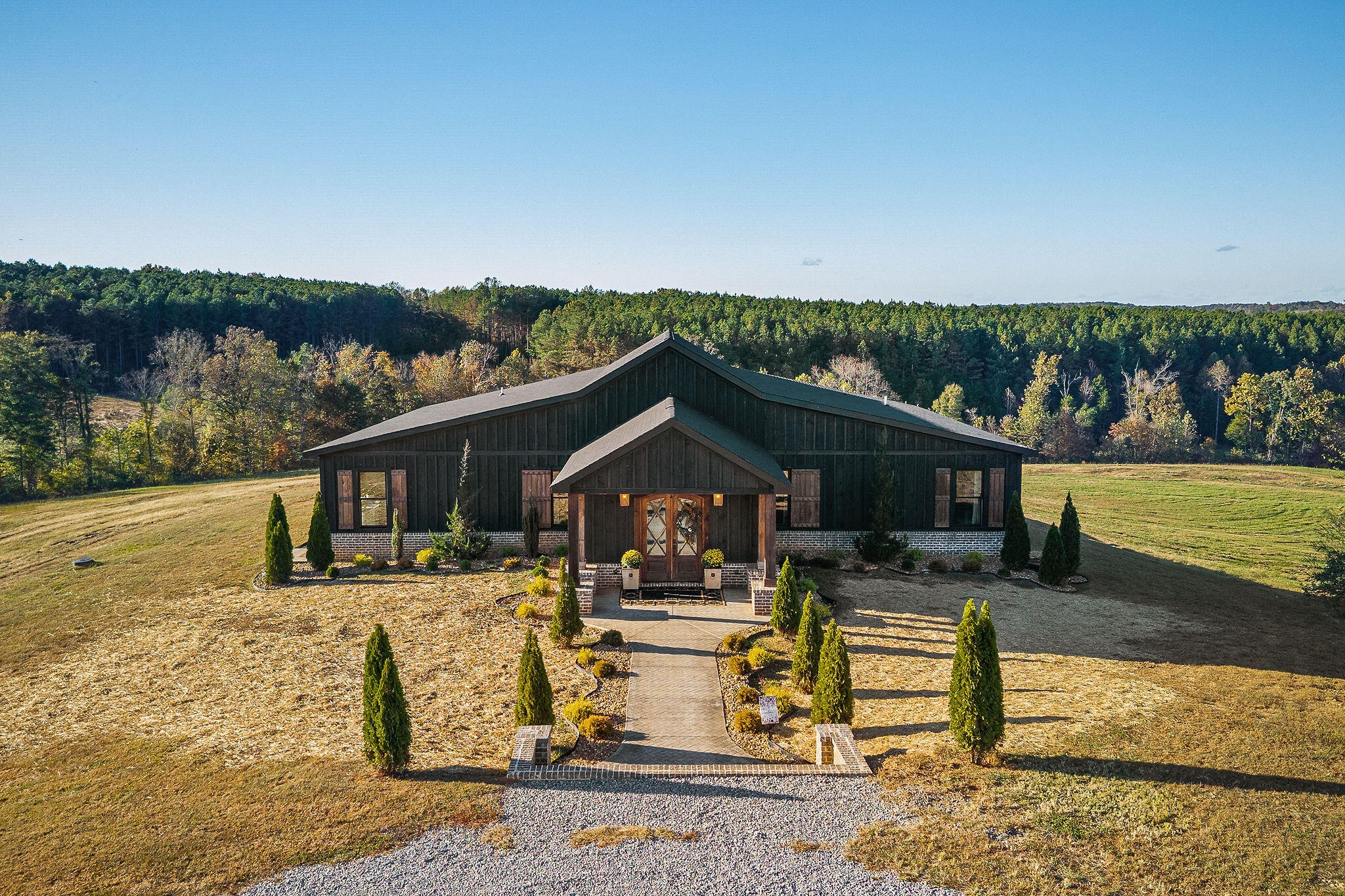 1656 Dibrell-Lucky Road McMinnville, TN 37110 - Photo 49 of 62 a front view of a house with swimming pool table and chairs