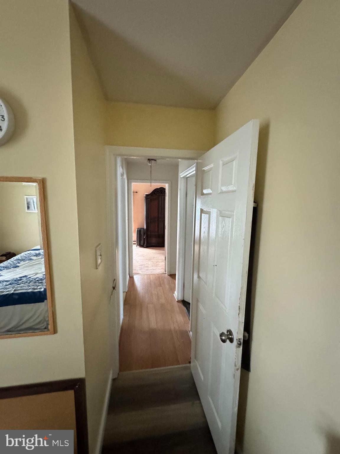 461 Old Erial Road Sicklerville, NJ 08081 - Photo 5 of 34 a view of a hallway with wooden floor and a living room