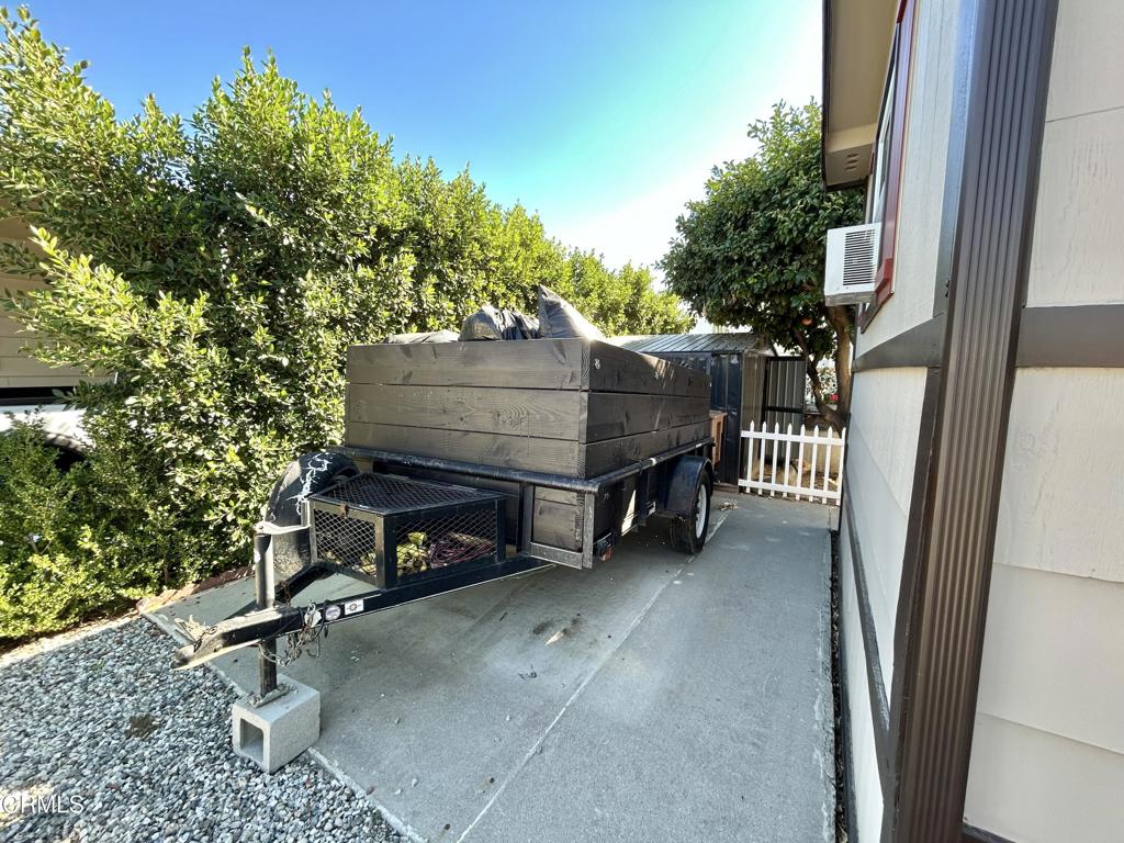250 East Telegraph Road, Unit 184 Fillmore, CA 93015 - Photo 15 of 16 a view of an outdoor sitting area with brick walls