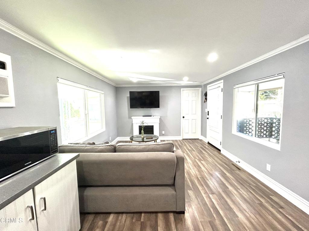 250 East Telegraph Road, Unit 184 Fillmore, CA 93015 - Photo 4 of 16 a bedroom with a balcony a bed and a flat screen tv