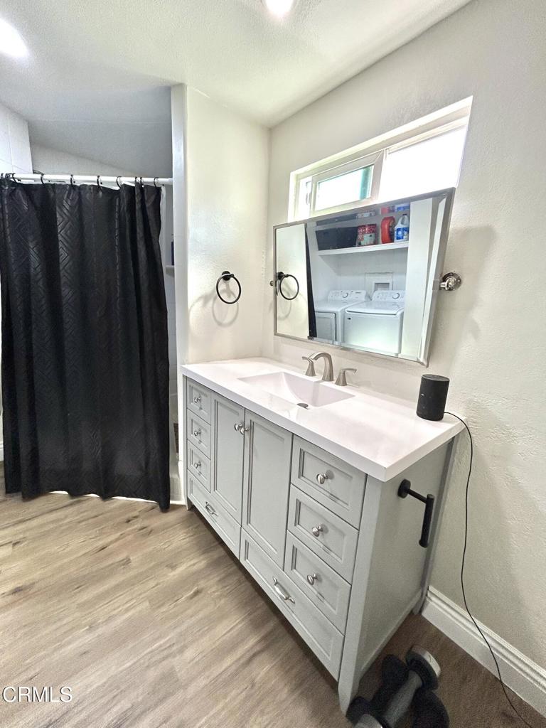 250 East Telegraph Road, Unit 184 Fillmore, CA 93015 - Photo 7 of 16 a bathroom with a sink vanity and mirror