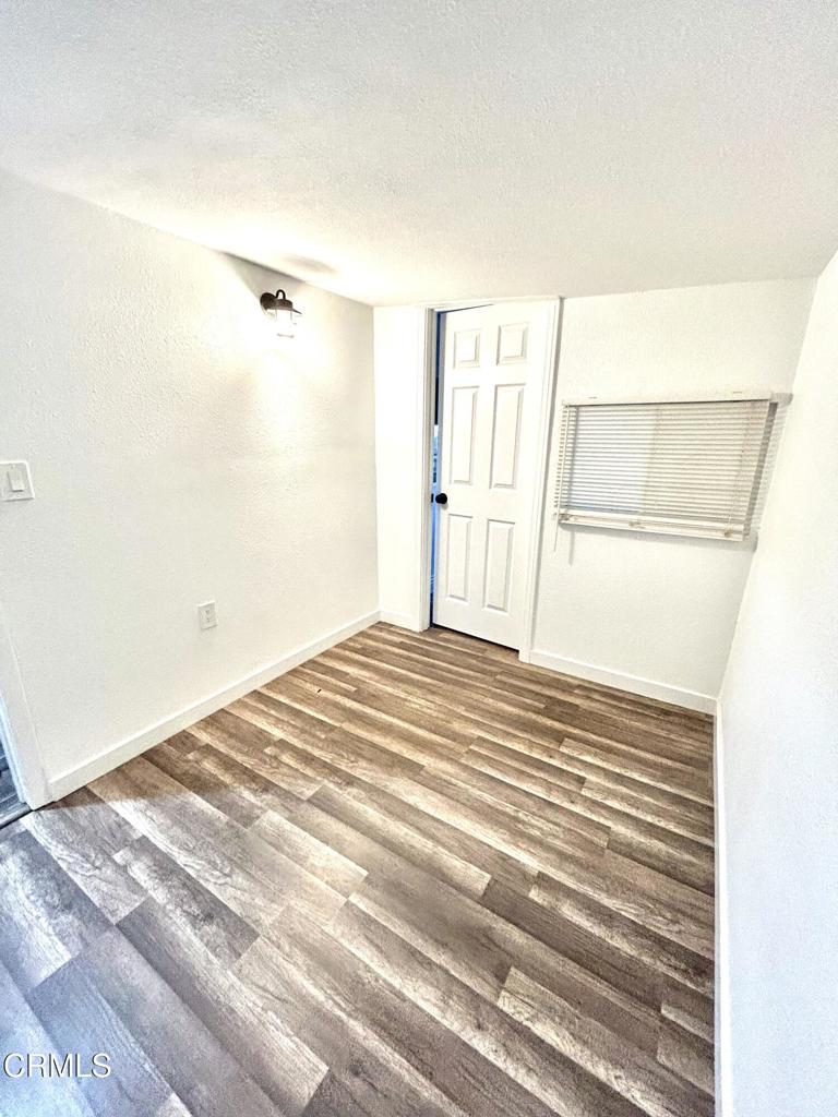 250 East Telegraph Road, Unit 184 Fillmore, CA 93015 - Photo 8 of 16 a view of a room with wooden floor