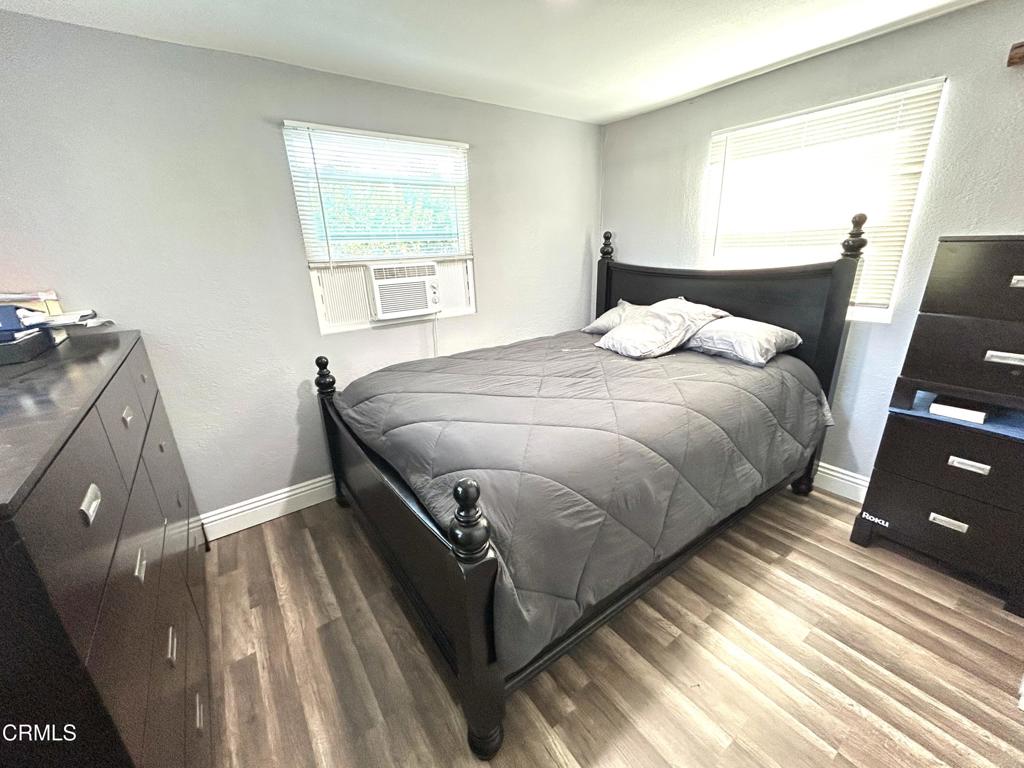 250 East Telegraph Road, Unit 184 Fillmore, CA 93015 - Photo 9 of 16 a bedroom with a bed and a window