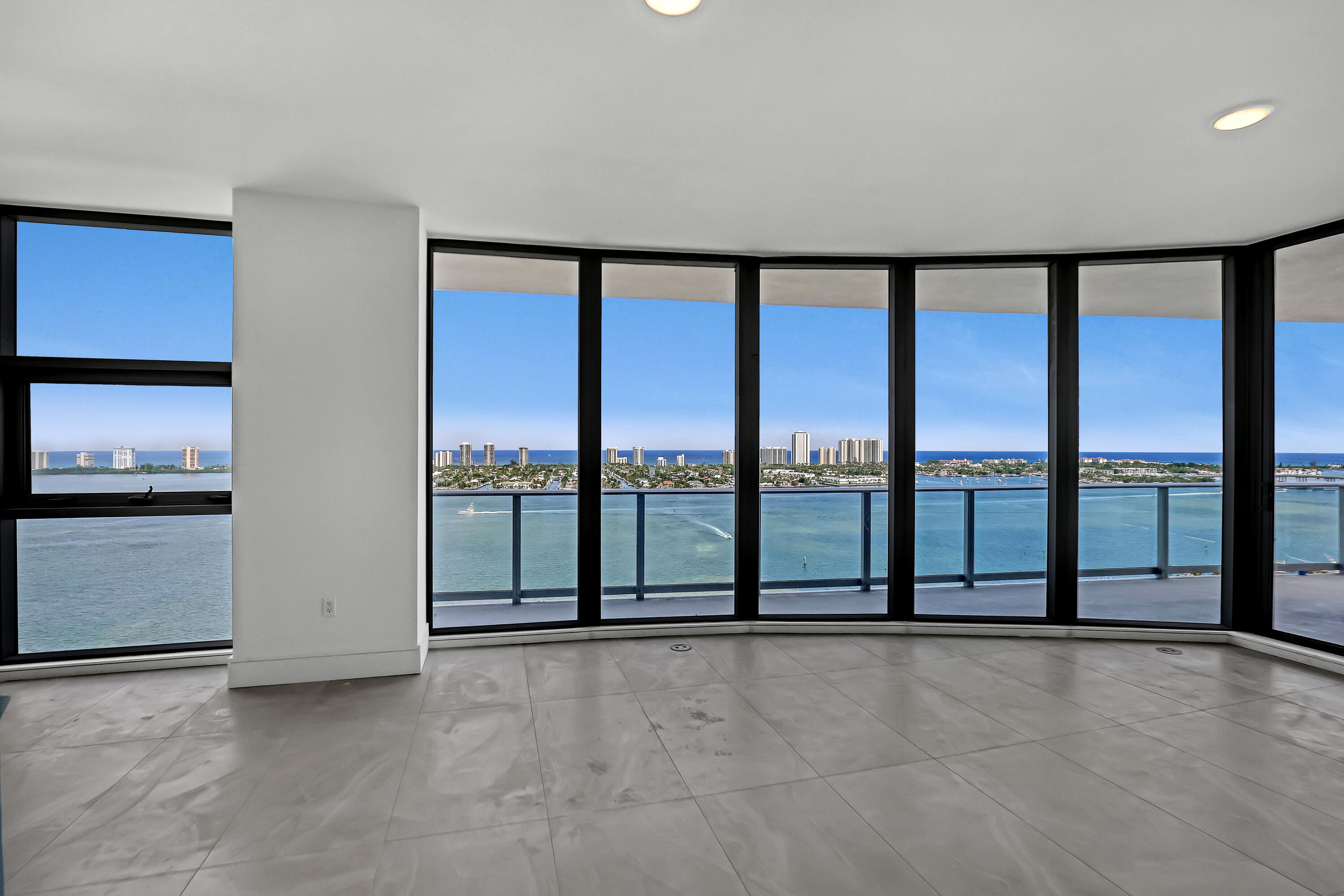 220 Lake Shore Drive, Unit N2103 Lake Park, FL 33403 - Photo 16 of 57 a view of an empty room with windows and city view