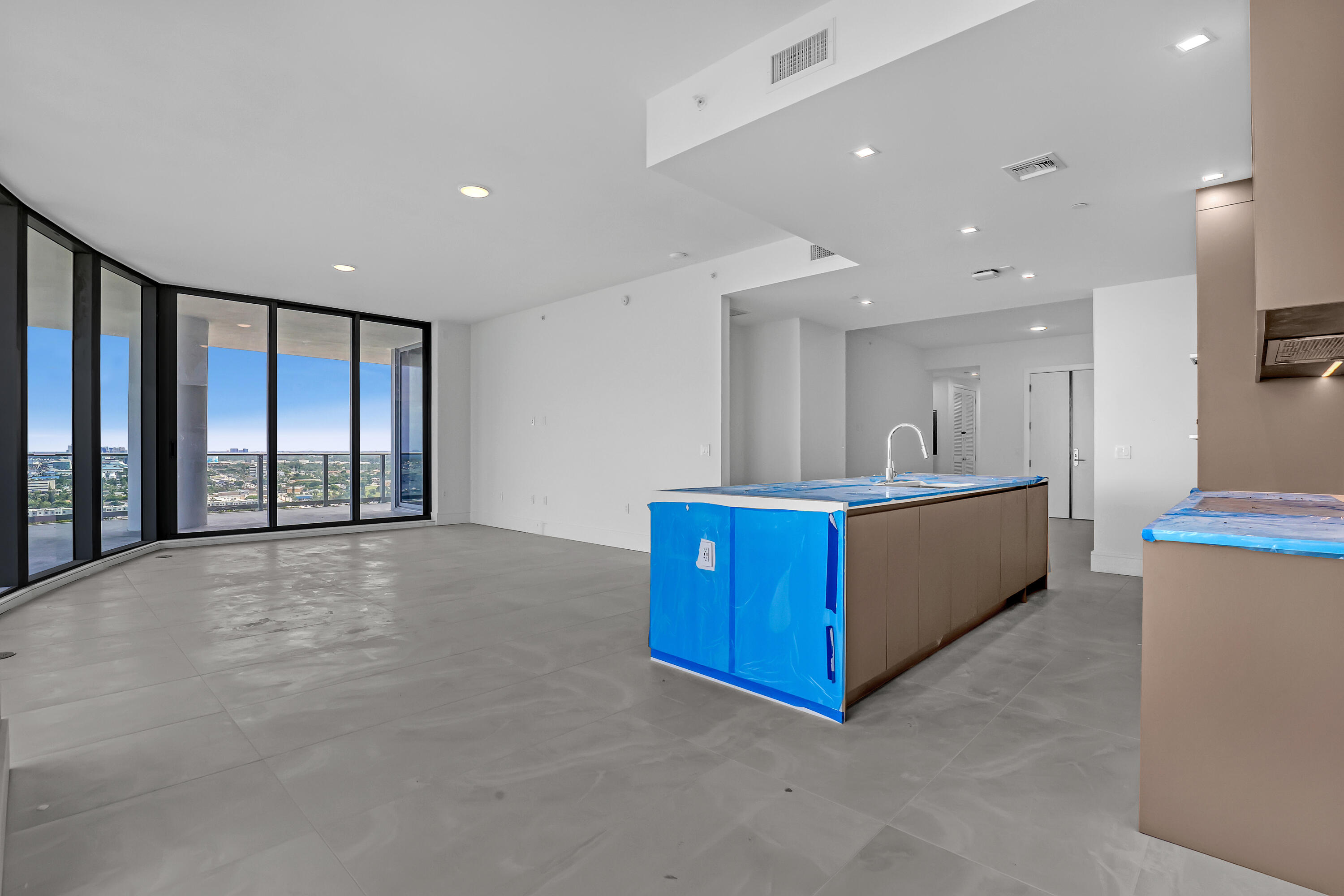 220 Lake Shore Drive, Unit N2103 Lake Park, FL 33403 - Photo 18 of 57 a view of an empty room with kitchen view and a window