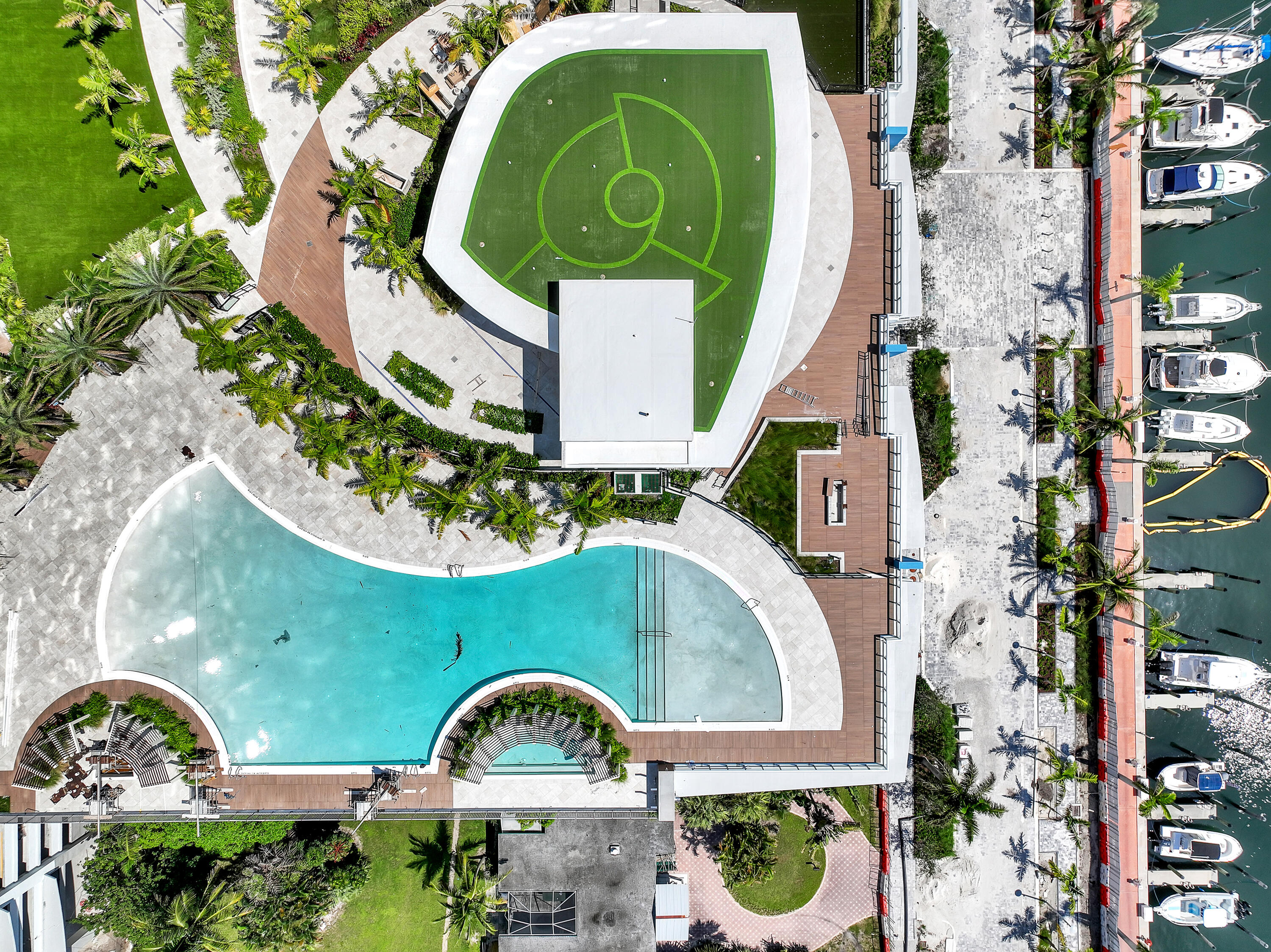 220 Lake Shore Drive, Unit N2103 Lake Park, FL 33403 - Photo 19 of 57 an aerial view of a house with a swimming pool and a garden