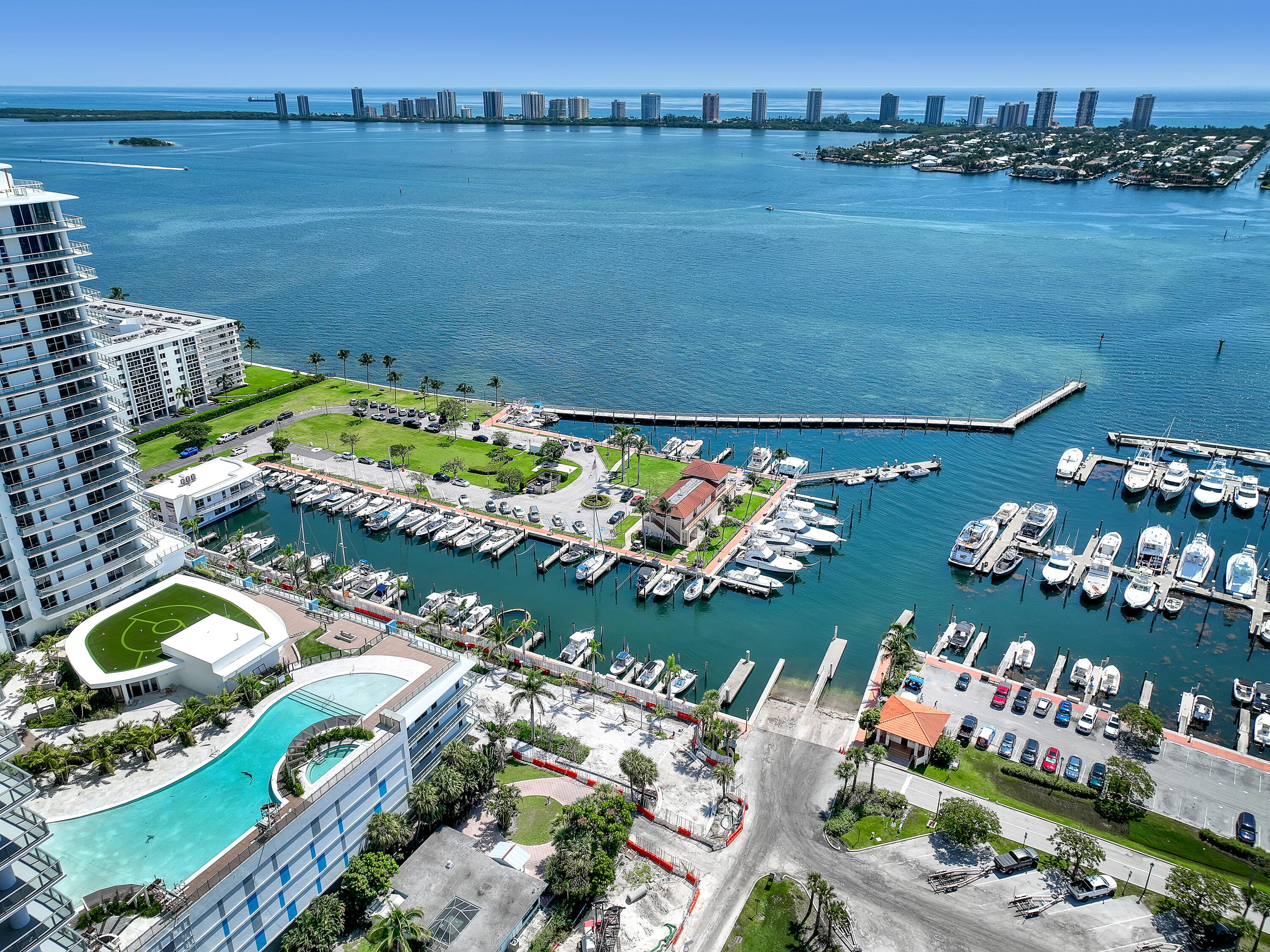 220 Lake Shore Drive, Unit N2103 Lake Park, FL 33403 - Photo 21 of 57 a view of a house with a lake yard and outdoor seating