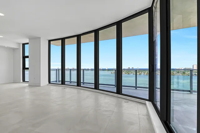 a view of a balcony next to a lake and mountain