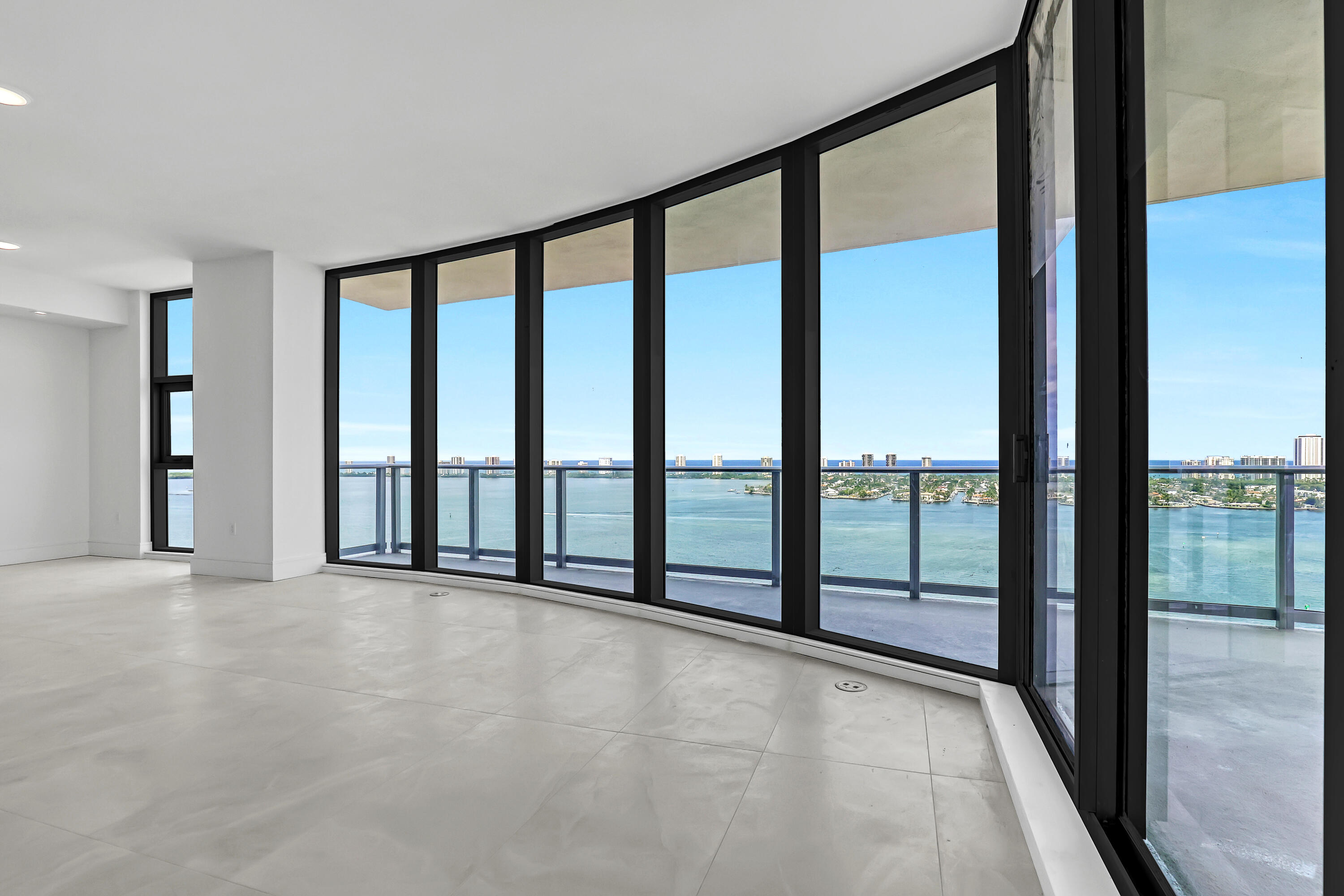 220 Lake Shore Drive, Unit N2103 Lake Park, FL 33403 - Photo 23 of 57 a view of an empty room with windows and a balcony