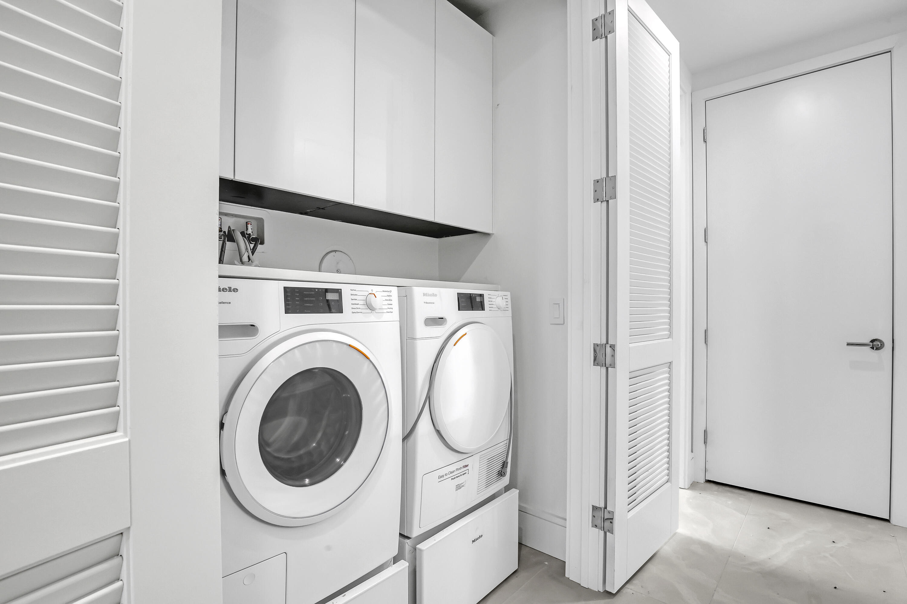 220 Lake Shore Drive, Unit N2103 Lake Park, FL 33403 - Photo 38 of 57 a utility room with dryer and washer